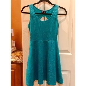 Teal skater-style dress with filigree design